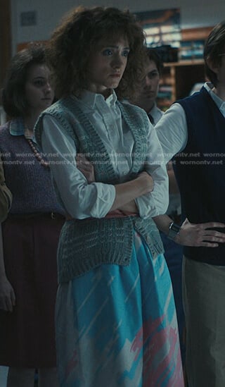 Nancy’s grey knit vest and printed skirt on Stranger Things