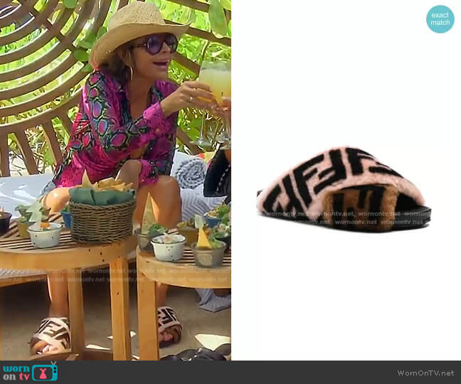 Fendi Logo Print Shearling Cross Strap Slides worn by Lisa Rinna on The Real Housewives of Beverly Hills