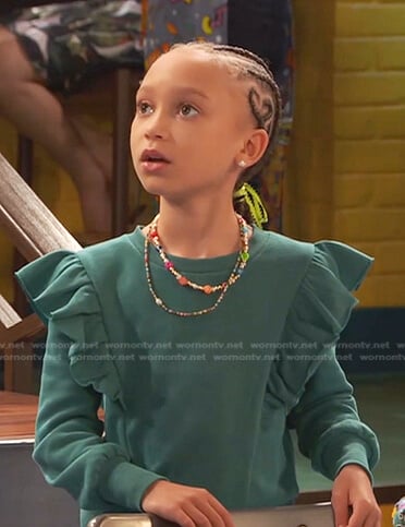 Alice’s green ruffle top on Ravens Home