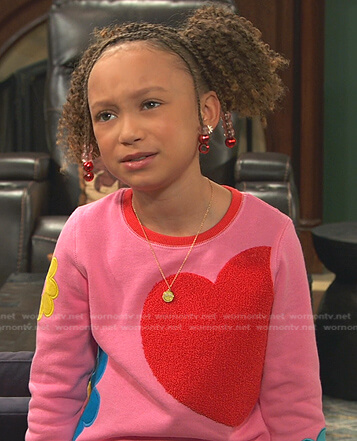 Alice’s pink heart and floral sweatshirt and sweatpants on Ravens Home
