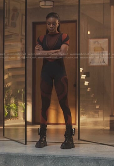 Cal’s orange and black colorblock top and leggings on First Kill