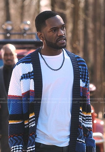 Chris’s multicolor knit cardigan on Tom Swift