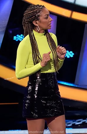 Corinne’s neon turtleneck sweater on Beat Shazam