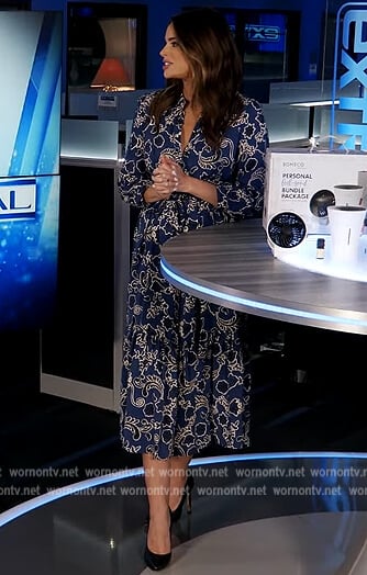 Jennifer’s blue floral print dress on Extra