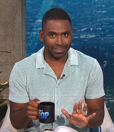 Justin’s sage green velour short sleeve shirt on E! News Daily Pop