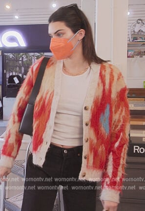 Kendall’s fuzzy cardigan and jeans on The Kardashians