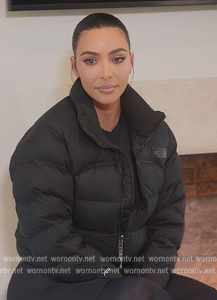 Kim’s black puffer jacket and leggings on The Kardashians