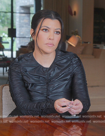 Kourtney’s black ruched top and pants on The Kardashians