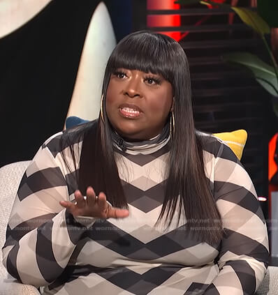 Loni’s black and white geometric mesh top on E! News Daily Pop