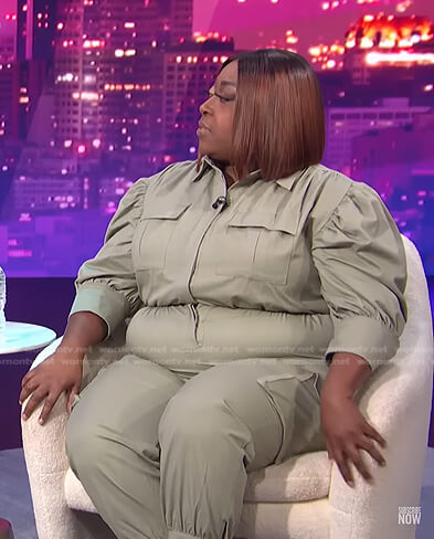 Loni’s sage green puff sleeve jumpsuit on E! News Nightly Pop