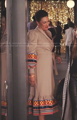 Lorraine’s beige embroidered wrap dress on Tom Swift
