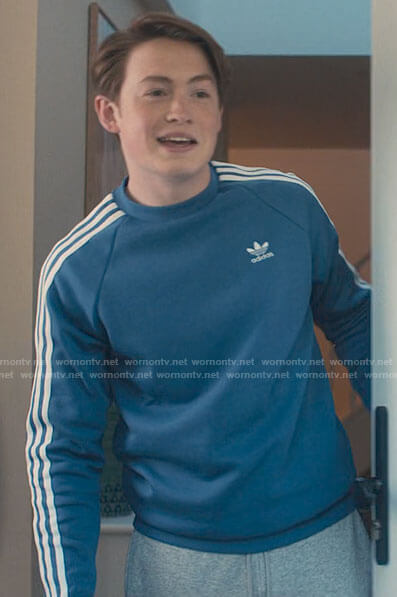 Nick’s blue Adidas stripe sleeve sweatshirt on Heartstopper