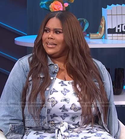 Nina’s blue butterfly print top and skirt on E! News Nightly Pop