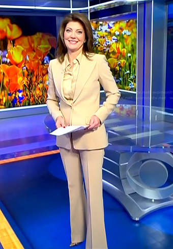 Norah’s satin blouse and beige suit on CBS Evening News