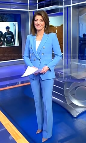 Norah’s blue double breasted blazer and pants on CBS Evening News