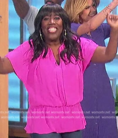 Sheryl’s pink v-neck top on The Talk