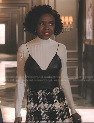 Zenzi’s black leather cami and tweed mini skirt on Tom Swift