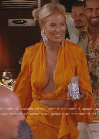 Caroline’s orange twist blouse and skirt on The Real Housewives of Dubai