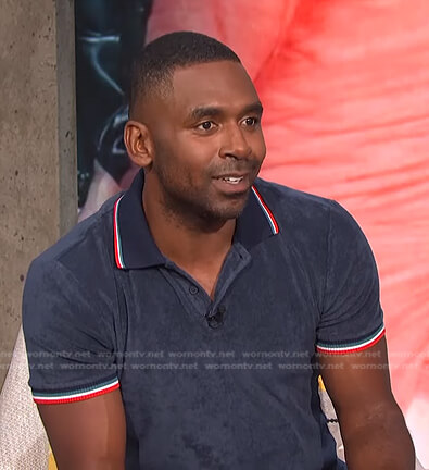 Justin’s navy striped trim terry polo shirt on E! News Daily Pop