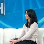 Dr. Natalie Azar’s black blouse and colorblock pleated skirt on Today