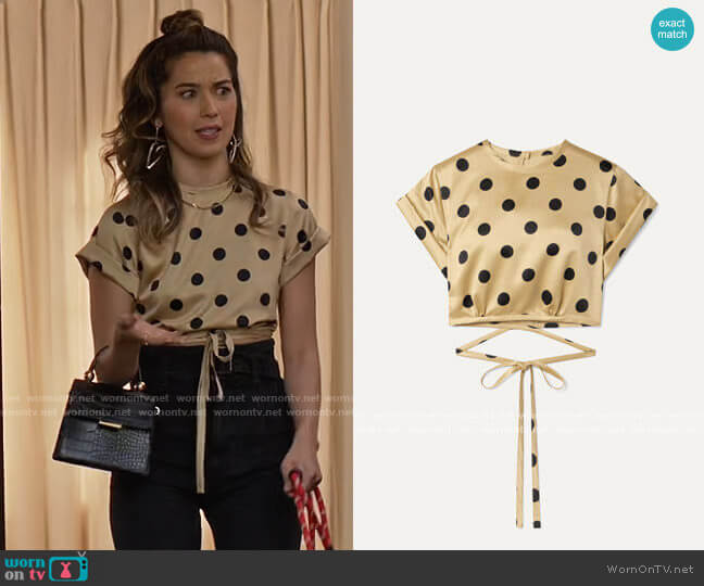 Orseund Iris Le Club cropped polka-dot satin top worn by Louise (Nichole Sakura) on Maggie