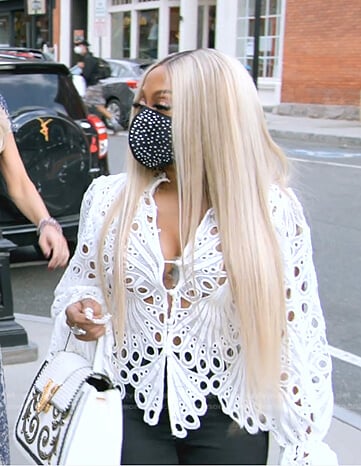 Phaedra’s white eyelet top and leather bag on The Real Housewives Ultimate Girls Trip
