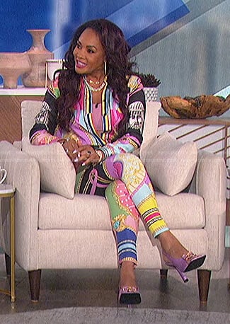 Vivica A. Fox’s multicolor print blouse and leggings on The Talk