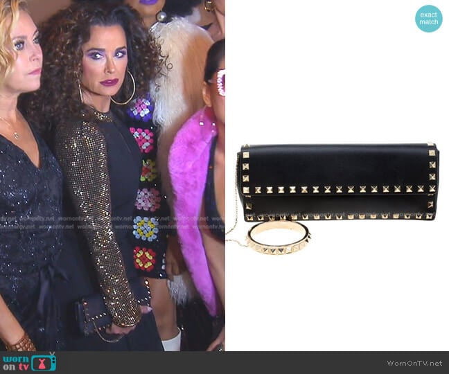 Valentino Leather Rockstud Bracelet Clutch worn by Kyle Richards on The Real Housewives of Beverly Hills