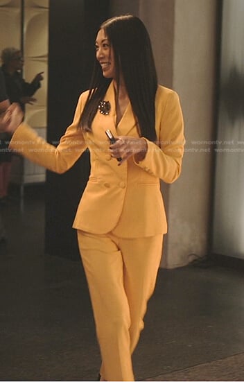 Claire’s yellow blazer and pants on Tom Swift