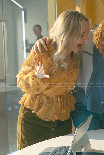 Claire’s yellow floral blouse and corduroy skirt on Good Trouble