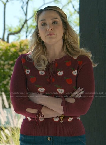Davia’s burgundy apple print sweater on Good Trouble