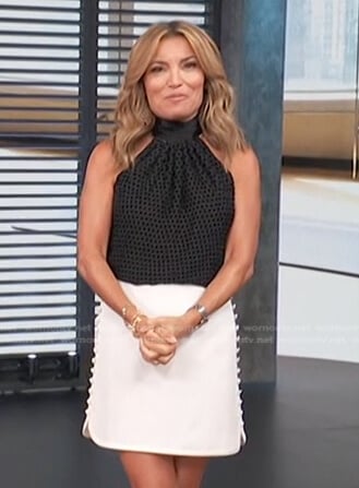 Kit’s white mini skirt on Access Hollywood