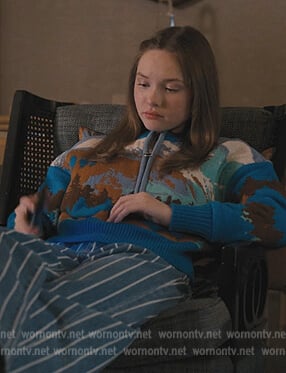 Lucy’s blue landscape print sweater on Only Murders in the Building
