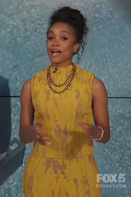 Rachel’s yellow textured top on Extra
