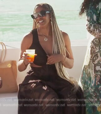 Sheree’s black cutout beach dress on The Real Housewives of Atlanta