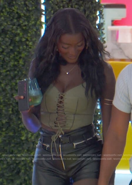 Zeta’s green lace-up corset top and leather shorts on Love Island USA