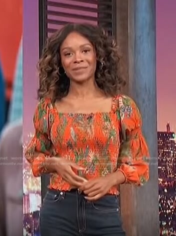 Zuri’s orange printed smocked top on Access Hollywood