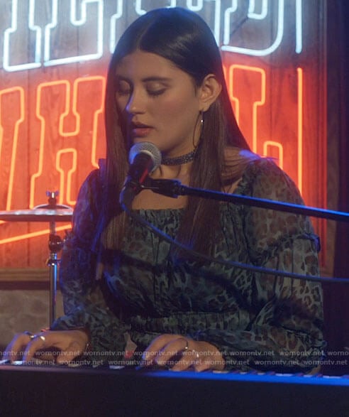 Ana’s teal green leopard print top and flared pants on Monarch