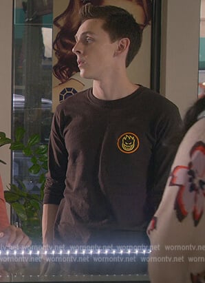 Eli’s black face flame print tee on Cobra Kai