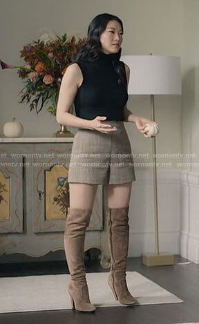 Ingrid’s houndstooth shorts and black sleeveless turtleneck on Partner Track