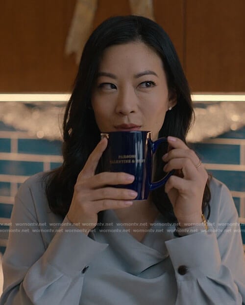 Ingrid’s blue cowl neck blouse and button front skirt on Partner Track