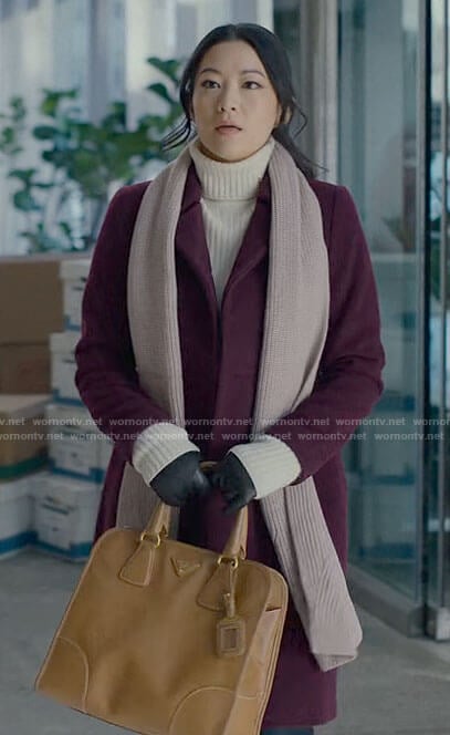 Ingrid’s purple coat and white turtleneck on Partner Track
