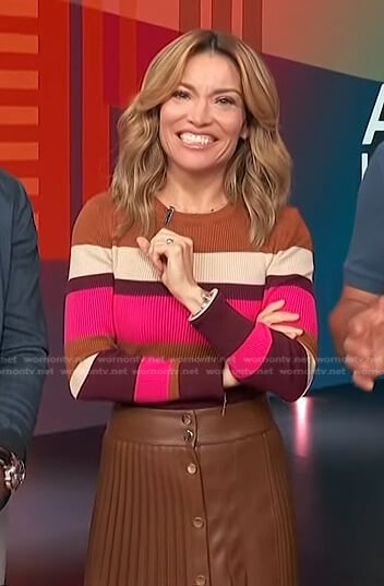 Kit’s multicolor striped ribbed sweater and pleated skirt on Access Hollywood