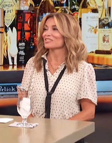 Kit’s white polka dot tie neck top on Access Hollywood