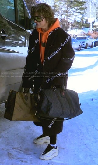 Lisa’s black logo print coat on The Real Housewives of Beverly Hills