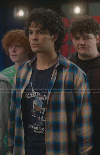 Miguel’s navy skeleton print tee on Cobra Kai