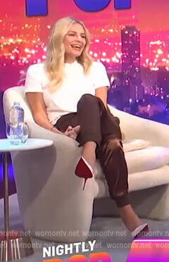 Morgan’s brown satin jogger pants on E! News Nightly Pop