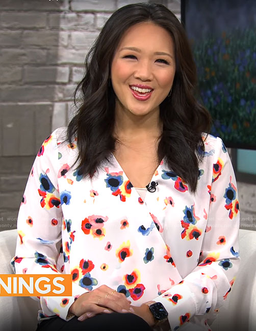 Nancy Chen’s white floral wrap blouse on CBS Saturday Morning
