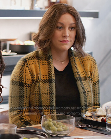 Sarah’s yellow plaid cardigan on Home Economics