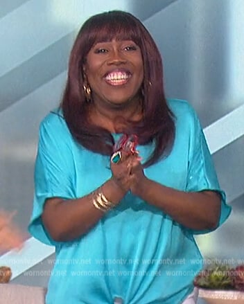 Sheryl’s blue satin tie front top on The Talk